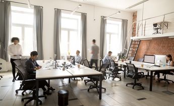 Corporate staff employees working together using computers at co Corporate staff employees working together using computers at co